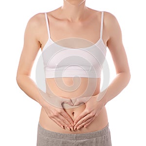 Young beautiful woman in white t-shirt top bra hands in heart belly health beauty