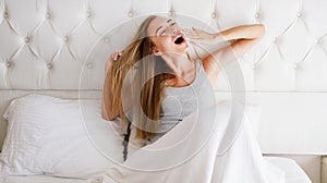 Young Beautiful Woman Yawning In Bed At Home : Relax Comfort Sleep Concept