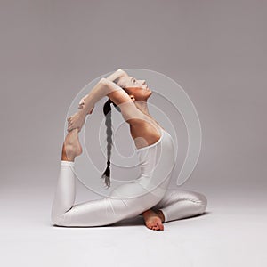 Young beautiful woman yoga posing. isolated