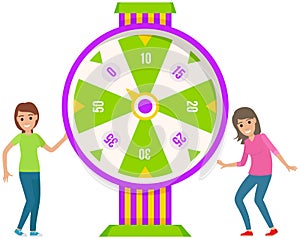 Young beautiful women dancing and celebrating victory. Spinning wheel of fortune to win jackpot