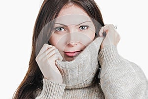 Young beautifull woman in big warm sweater