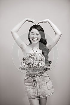 Young beautifull woman in summer dress black-white studio portrait