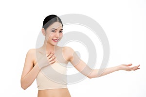 Young beauty Asian face, beautiful woman showing empty hand isolated over white background. Healthcare and Skincare concept.