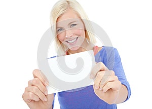Young beauty endorsing your product. A beautiful young woman holding a blank card while isolated on a white background.