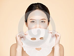 Young beauty face and facial mask