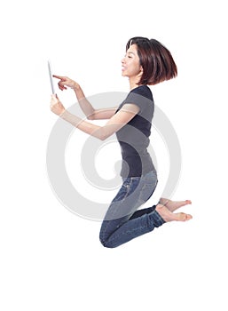 Young beauty happy jump and using tablet pc