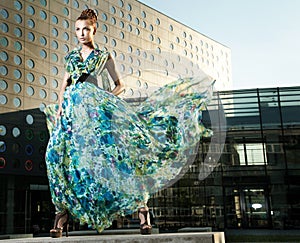 young beauty posing over urban background