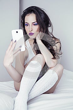 Young beauty taking selfie