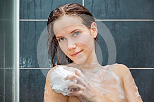 Young beauty under shower