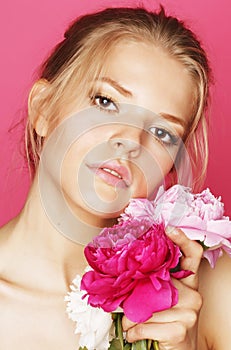 Young beauty woman with flower peony pink closeup makeup soft tender gentle look