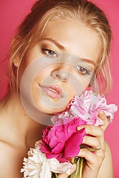 Young beauty woman with flower peony pink closeup makeup soft tender gentle look