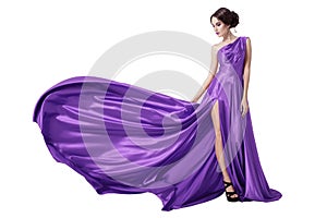 Young Beauty Woman In Fluttering Violet Dress. Isolated