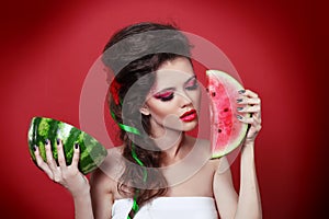 Young beauty woman holding watermelon