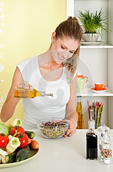 Young beauty woman making sprouts salad