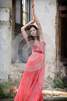 young beauty woman red dress in smoke