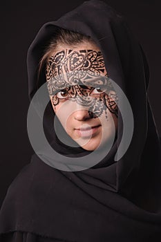 Young beauty woman with tracery on the face