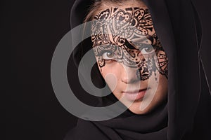 Young beauty woman with tracery on the face
