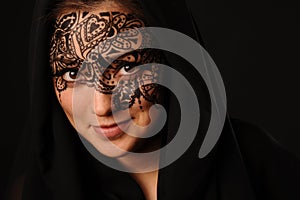 Young beauty woman with tracery on the face