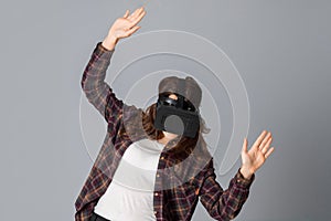 Young beauty woman in virtual reality helmet