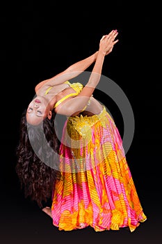 Young belly dancer in backbend to left