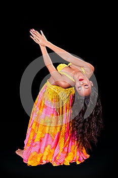 Young belly dancer in backbend to right