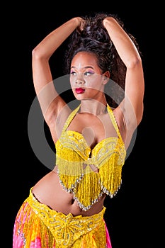 Young belly dancer pushing up her hair