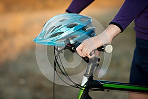 Young bicyclist in helmet