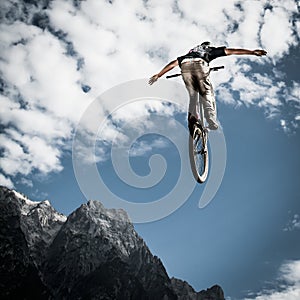 Young biker jumps handfree