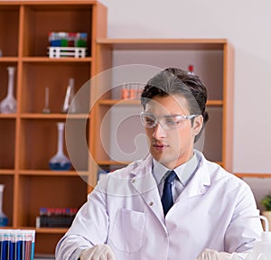 Young biochemist working in the lab