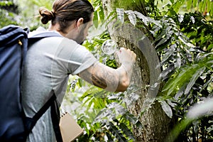 Young Biologist working in a tropical forest