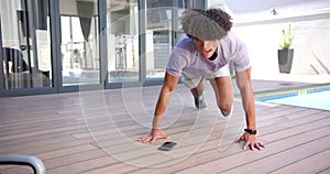 A young biracial man is doing push-ups outdoors in the backyard at home with copy space