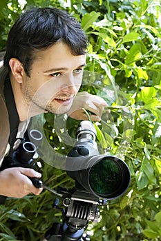 Young bird watcher with telescope