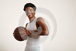 Young black athlete holding a basketball