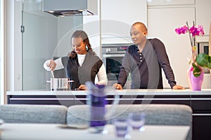 Young black couple in kitchen