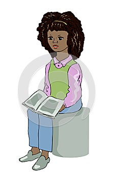 Young black girl sitting and reading a book