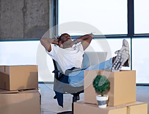 Young black male architect taking a break on construction site