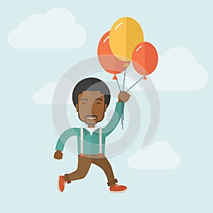 Young black man flying with balloons