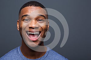 Young black man with funny smiling expression