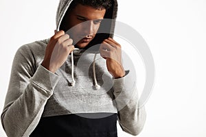 Young black man in gray and hoodie