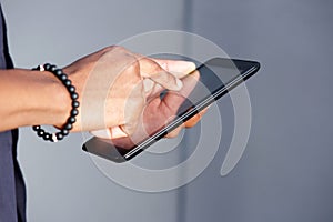 Young black man hands using digital tablet