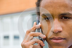 Young black man with mobile