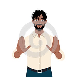 Young black man show no hand gesture. Serious male demonstrate stop sign