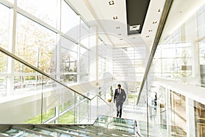 Young black man walking in office