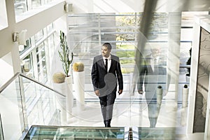 Young black man walking in the office