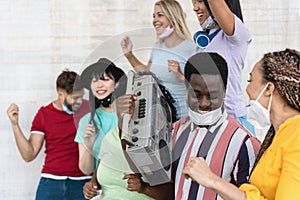 Young black man wearing face mask during equal rights protest - Concept of demonstrators on road for no racism campaign- Focus on