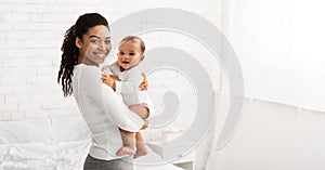 Young Black Mom Holding Baby Toddler Posing Standing Indoors, Panorama