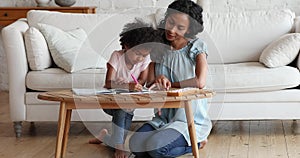 Young Black mommy explain math basics to preschool age daughter