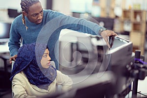 Young black muslim female software developer at work