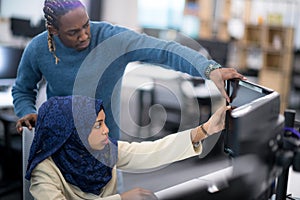 Young black muslim female software developer at work photo
