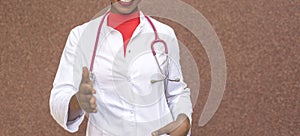 Young black-skinned girl doctor in a white coat stretches out her hand for a welcome handshake. On a red background